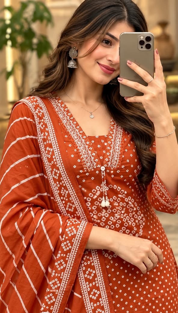 Close-up of bandhani print kurta with tassel neckline